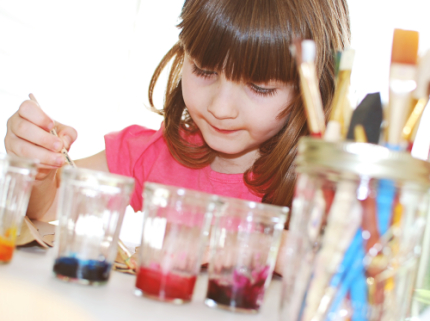 Child Painting with watercolors